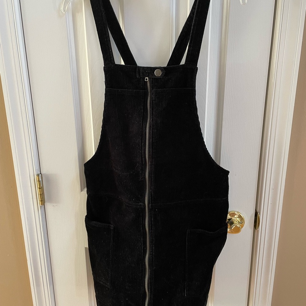 Forever 21 black jumper dress with front zipper. NWT. Non-smoking home.
